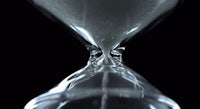 a sand hourglass on a black background